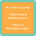 A square Drinks on Me coasterwith rounded corners featuring a peach-orange center panel with white text reading three lines: “A VODKA PLEASE,” “UMM THIS IS MCDONALD’S,” and “OKAY, A MCVODKA THEN.” The panel is surrounded by a mint-green border. Available at Be Charmed