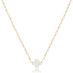 enewton 16-inch gold-filled chain necklace with a small white cross-shaped pendant. Available at Be Charmed