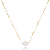 enewton 16-inch gold-filled chain necklace with a small white cross-shaped pendant. Available at Be Charmed