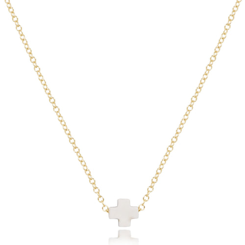 enewton 16-inch gold-filled chain necklace with a small white cross-shaped pendant. Available at Be Charmed