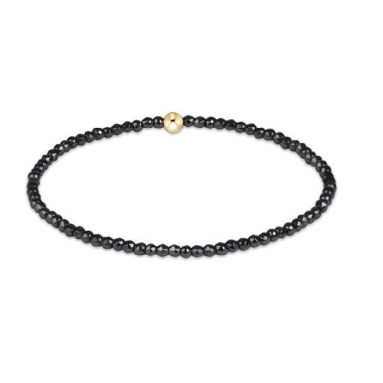 Faceted hematite enewton classic 2mm bracelet featuring polished gold-filled beads available at Be Charmed
