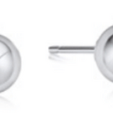 Pair of enewton silver stud earrings on a white background. Available at Be Charmed