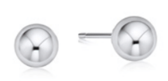 Pair of enewton silver stud earrings on a white background. Available at Be Charmed