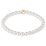 enewton 5 mm Pearl bracelet with a gold clasp on a white background. Available at Be Charmed