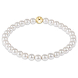 enewton 5 mm Pearl bracelet with a gold clasp on a white background. Available at Be Charmed