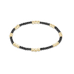 Faceted hematite enewton Joy 2mm bracelet featuring gold-filled beads with a colorful accent available at Be Charmed