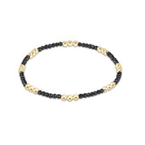 Faceted hematite enewton Joy 2mm bracelet featuring gold-filled beads with a colorful accent available at Be Charmed