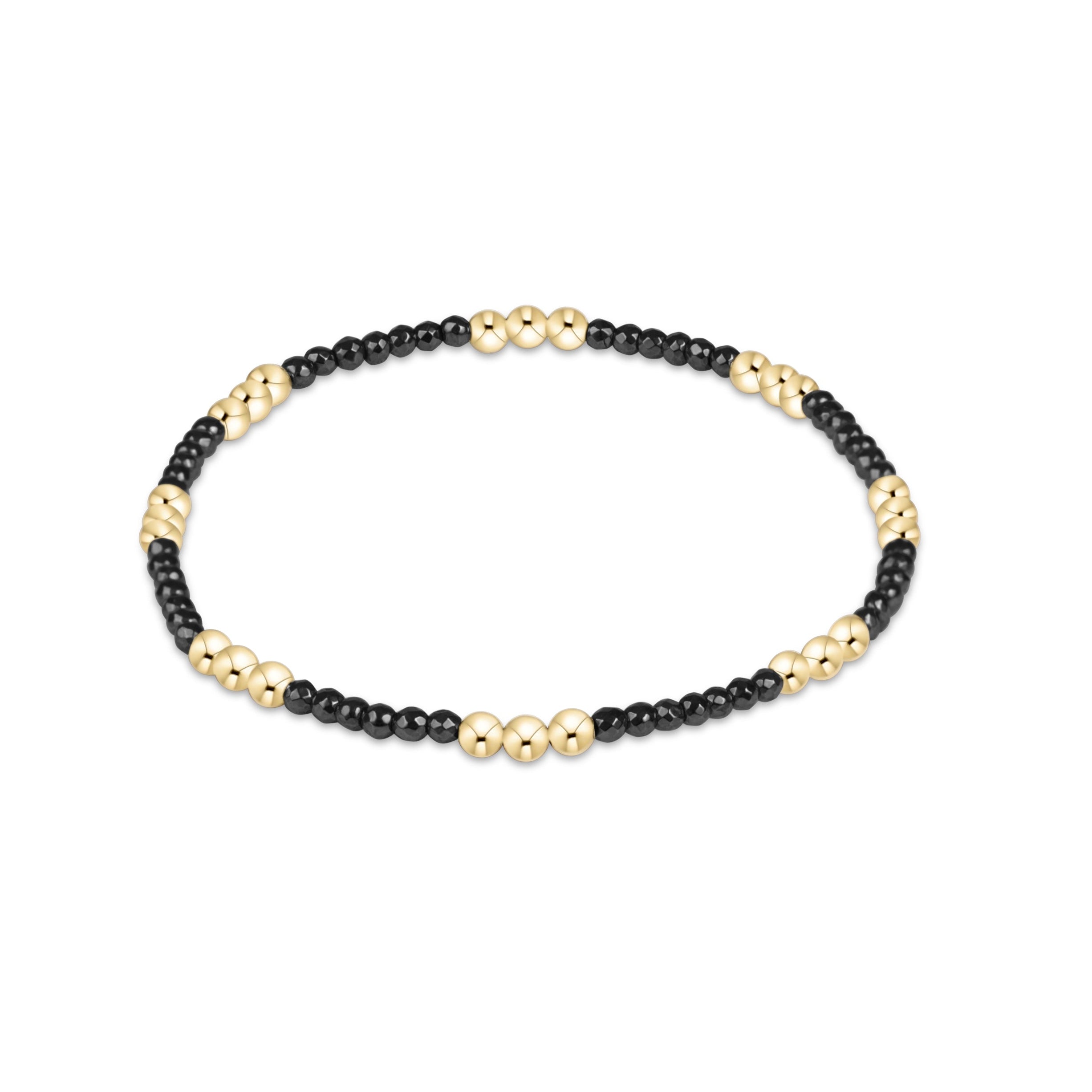 Faceted hematite enewton Joy 2mm bracelet featuring gold-filled beads with a colorful accent available at Be Charmed