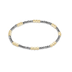 Silver faceted hematite enewton Joy 2mm bracelet featuring gold-filled beads with a colorful accent available at Be Charmed