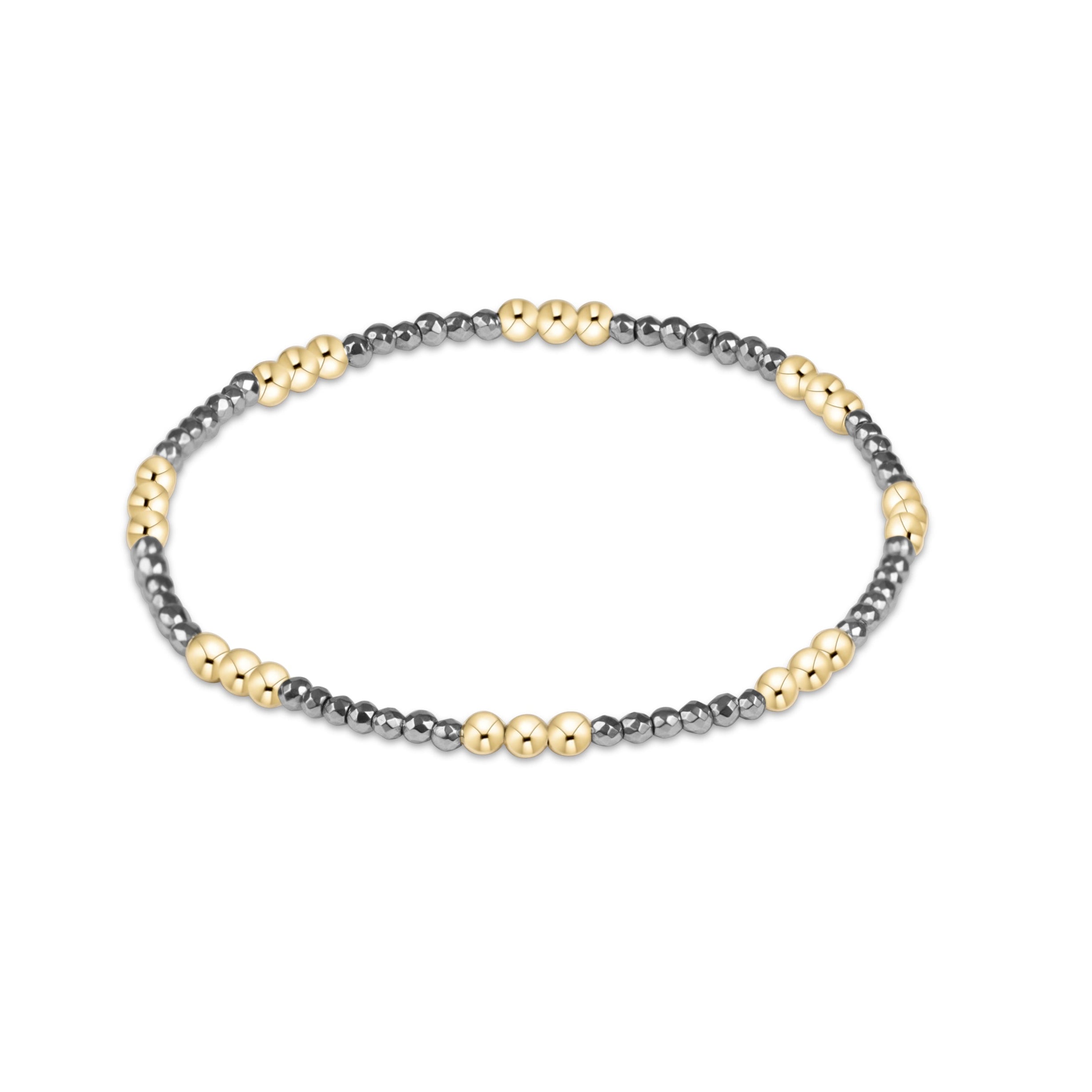 Silver faceted hematite enewton Joy 2mm bracelet featuring gold-filled beads with a colorful accent available at Be Charmed