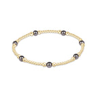 enewton Purpose Pearl Dark Grey 4mm Gold Bracelet featuring dark grey pearls and gold-filled beads available at Be Charmed