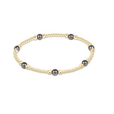 enewton Purpose Pearl Dark Grey 4mm Gold Bracelet featuring dark grey pearls and gold-filled beads available at Be Charmed