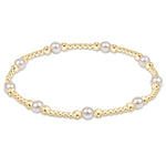 enewton 4 mm Purpose Pearl bracelet with gold accents on a white background. Available at Be Charmed