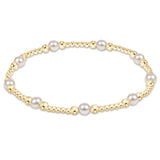 enewton 4 mm Purpose Pearl bracelet with gold accents on a white background. Available at Be Charmed