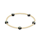 enewton Signature Cross Small 2mm Gold Bracelet featuring Mother of Pearl and Black Tahitian accents available at Be Charmed