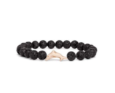 A beaded stretch Fahlo bracelet made of black porous lava stones with a small light beige dolphin charm in the center, shown on a plain white background. Available at Be Charmed