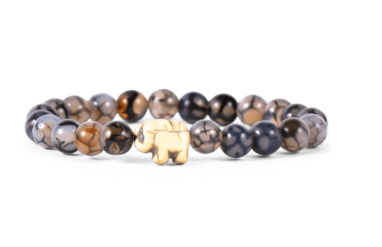 A beaded stretch bracelet featuring polished round beads in smoky gray, black, and brown marbled patterns, with a small elephant charm at the front center, set against a plain white background. Available at Be Charmed