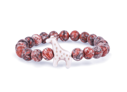 A beaded stretch Fahlo bracelet featuring round reddish-brown and white marbled beads with a small white giraffe charm in the center, set against a plain white background. Available at Be Charmed