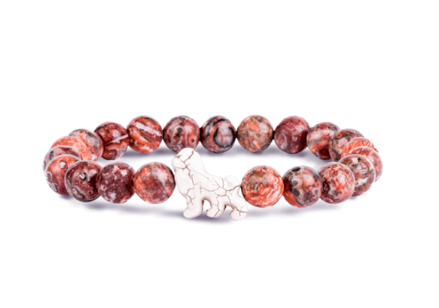 A beaded stretch Fahlo bracelet featuring round reddish-brown and black marbled beads with a small white ceramic lion charm in the center, displayed on a clean white background. Available at Be Charmed