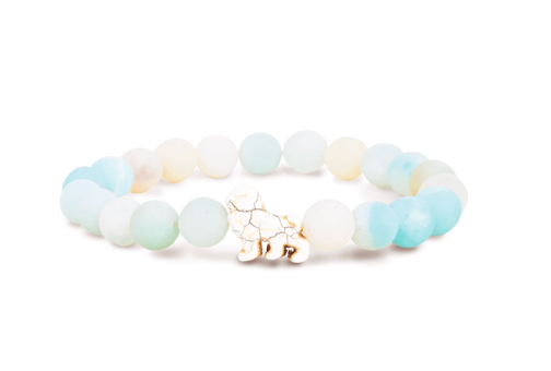 A beaded stretch Fahlo bracelet featuring light blue, white, and pale yellow-green gradient beads, with a small lion charm at the center, set against a plain white background. Available at Be Charmed