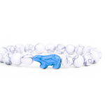A beaded stretch Fahlo bracelet featuring white and gray marbled beads with a central blue polar bear charm, shown on a plain white background. Available at Be Charmed