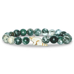 A beaded stretch Fahlo bracelet featuring green and white marbled round beads, with a small red panda charm, set against a plain white background. Available at Be Charmed