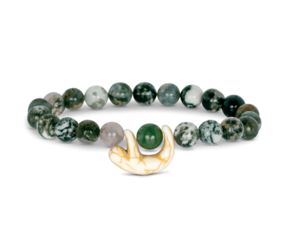 A beaded stretch Fahlo bracelet featuring dark green and white marbled beads, a single smooth green bead, and a small carved cream-colored sloth charm, displayed on a clean white background. Available at Be Charmed