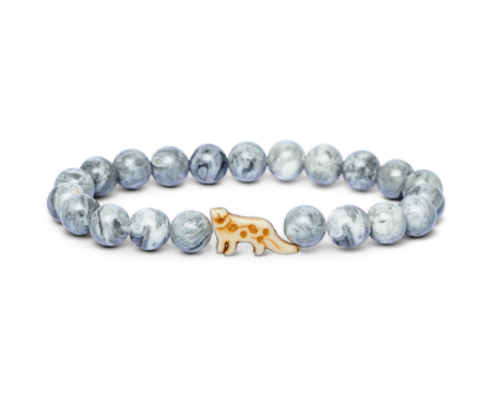 A beaded stretch Fahlo bracelet featuring light blue and white marbled round beads with a small central snow leopared charm, displayed on a clean white background. Available at Be Charmed