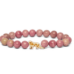 A beaded stretch Fahlo bracelet featuring round pinkish-red beads with one snow leopard charm, displayed on a clean white background. Available at Be Charmed