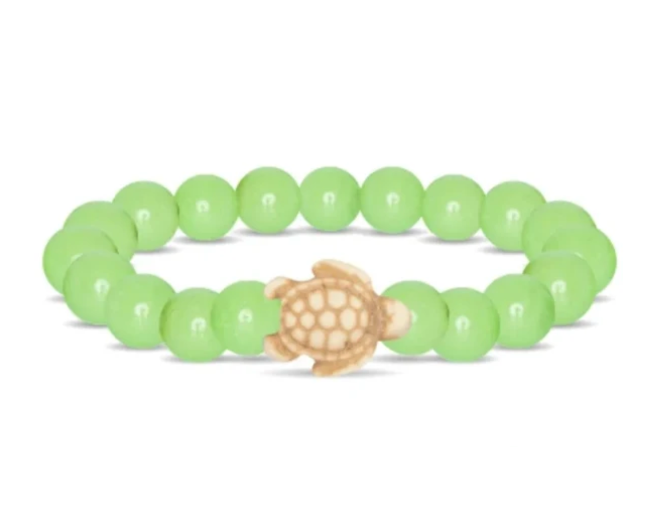 A beaded stretch Fahlo bracelet featuring a sage glow round beads and a central carved turtle charm in a natural tan wood tone, shown on a plain white background. Available at Be Charmed