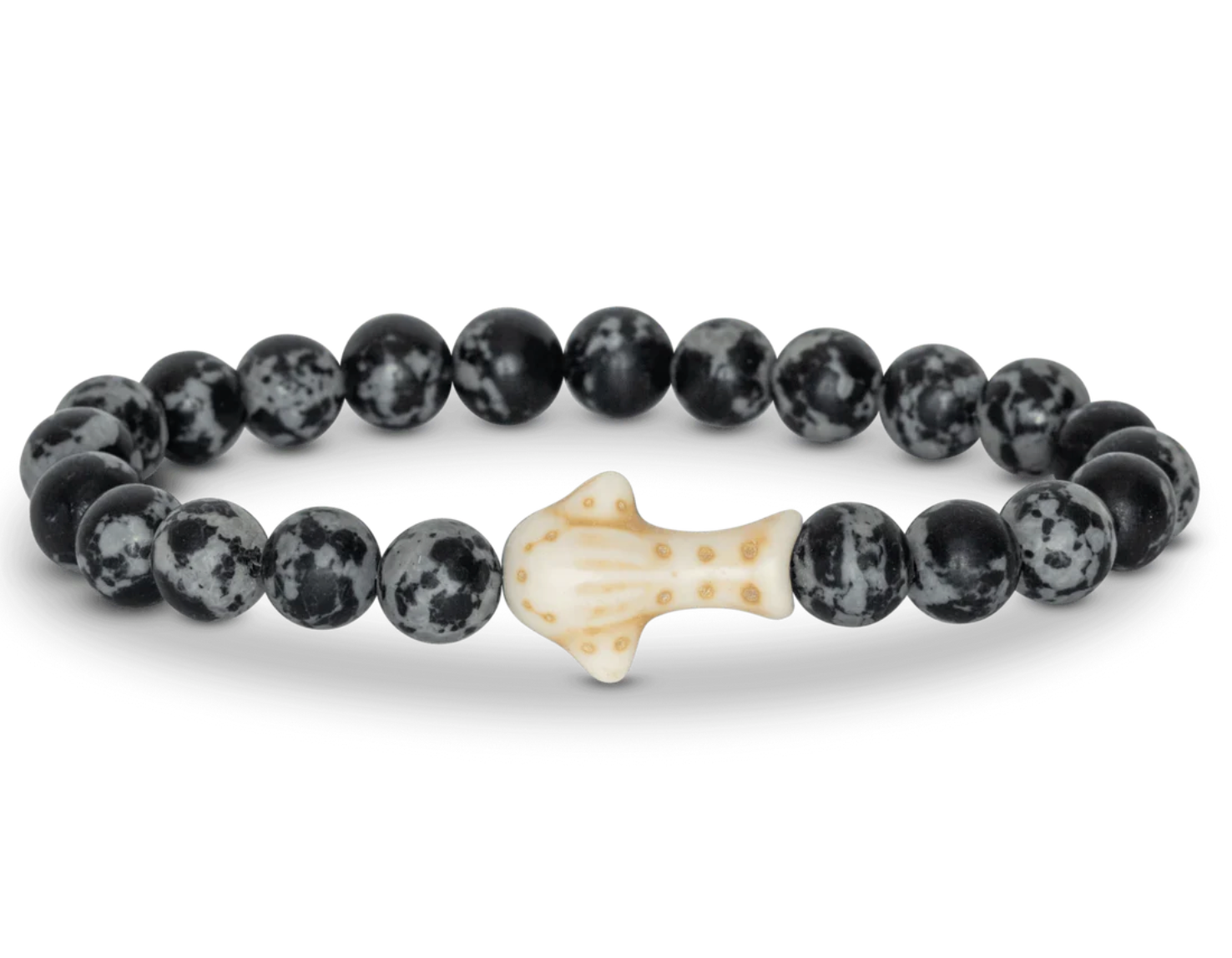 A beaded stretch Fahlo bracelet featuring round black and white mottled beads with a central off-white whale shark, shown on a plain white background. Available at Be Charmed