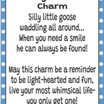 A charm card or print with a white center, black text reading 'Silly Goose Charm' and a humorous goose quote, framed by a blue-and-white polka dot border. The brand name GANZ appears at the bottom. Available at Be Charmed