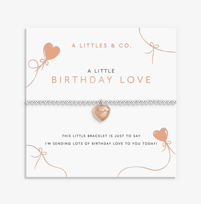 A littletes & Co. rose gold bracelet with a heart-shaped charm, displayed on its white gift card with birthday-themed text and illustrations. Available at Be Charmed