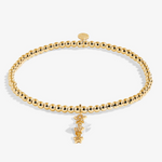 A Littles & Co Birthday Wish gold bracelet featuring a delicate gold charm on a beaded band, available at Be Charmed