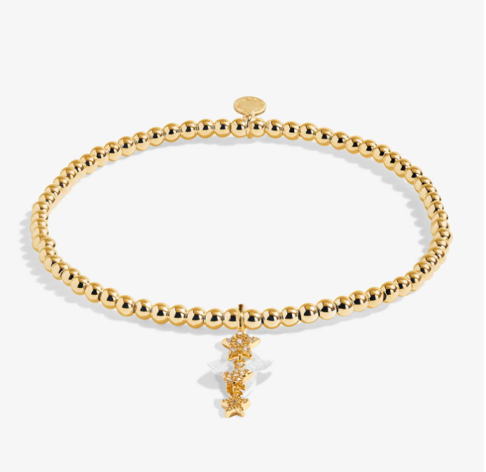 A Littles & Co Birthday Wish gold bracelet featuring a delicate gold charm on a beaded band, available at Be Charmed