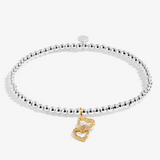 A Littles & Co Confetti Happy Birthday silver and gold bracelet featuring a mixed-metal charm on a beaded band, available at Be Charmed
