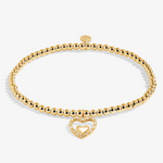 A Littles & Co Happy Birthday Nana gold bracelet featuring a delicate gold charm on a beaded band, available at Be Charmed