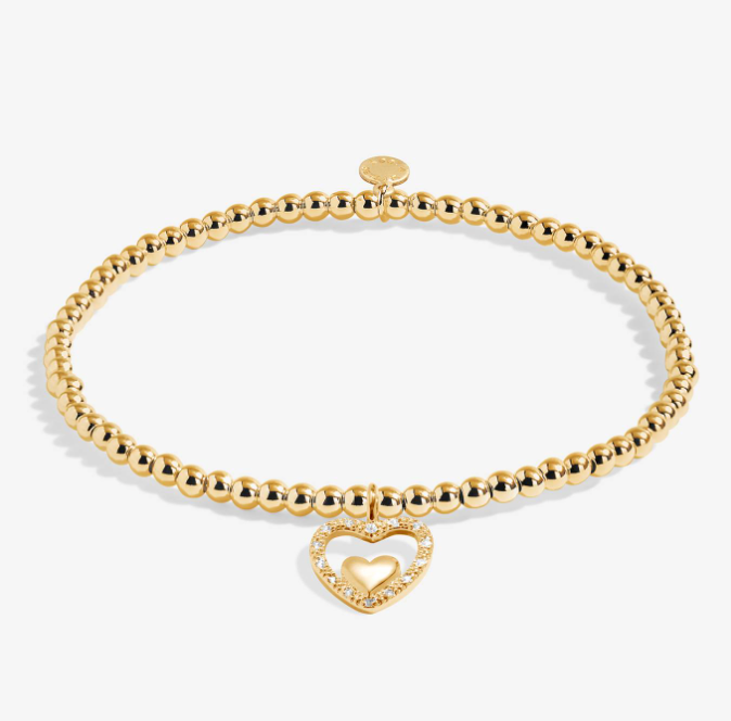 A Littles & Co Happy Birthday Nana gold bracelet featuring a delicate gold charm on a beaded band, available at Be Charmed