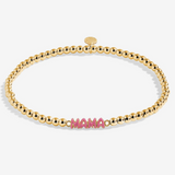A Littles & Co Hey Mama gold bracelet featuring a delicate gold charm on a beaded band, available at Be Charmed