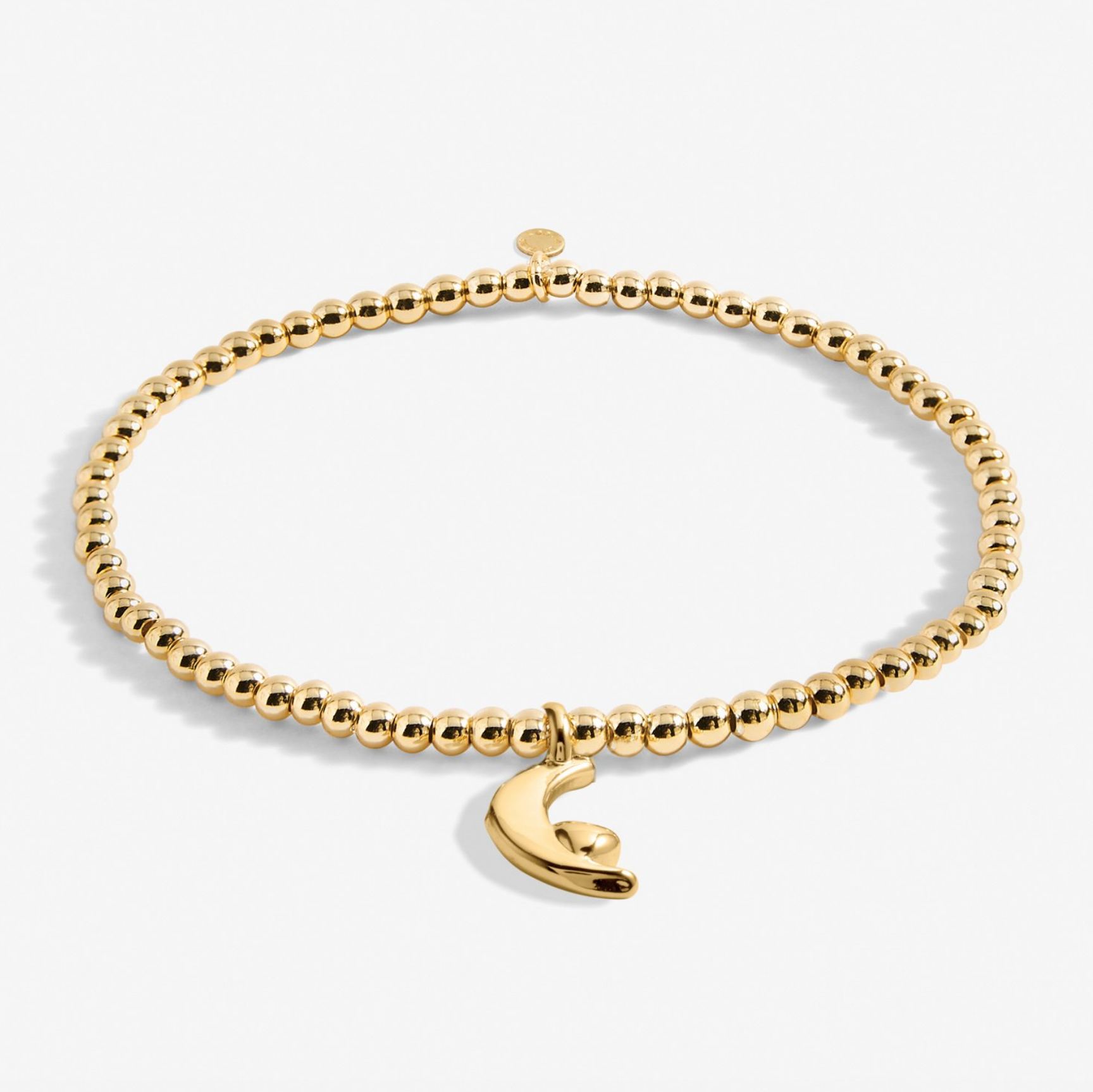 A Littles & Co Little Love You To The Moon And Back gold bracelet featuring a delicate crescent moon charm on a beaded band, available at Be Charmed