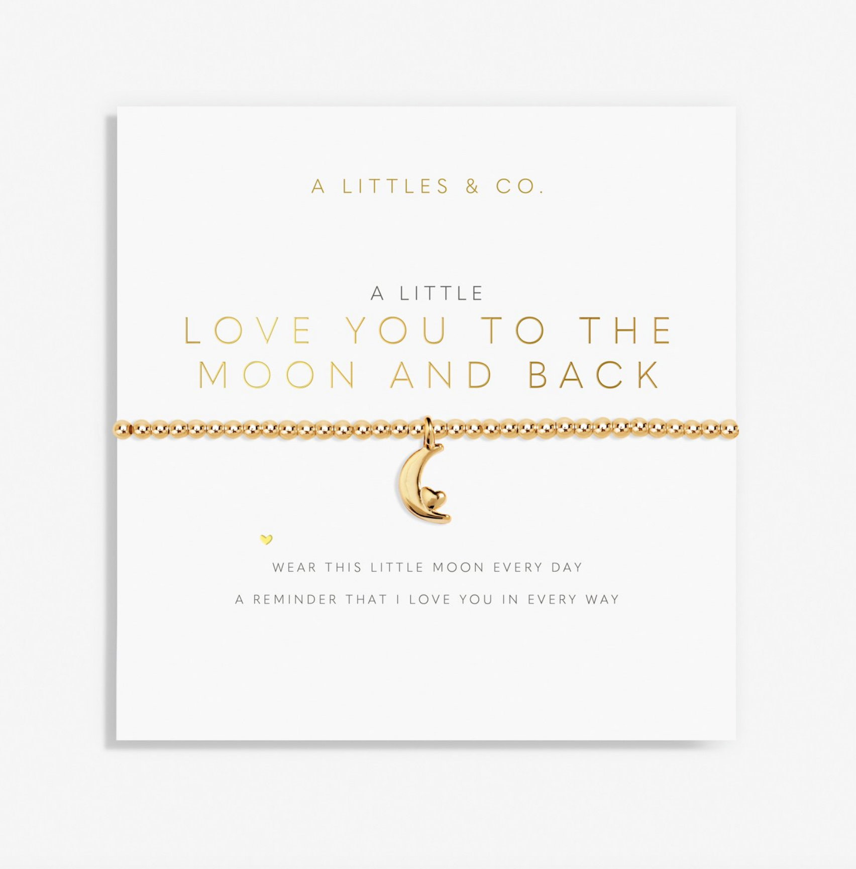 A gold chain bracelet with a crescent moon charm featuring a cat inside the moon, displayed on a white card from A Littles & Co. The card has gold foil text that reads 'A LITTLE LOVE YOU TO THE MOON AND BACK'. Available at Be Charmed