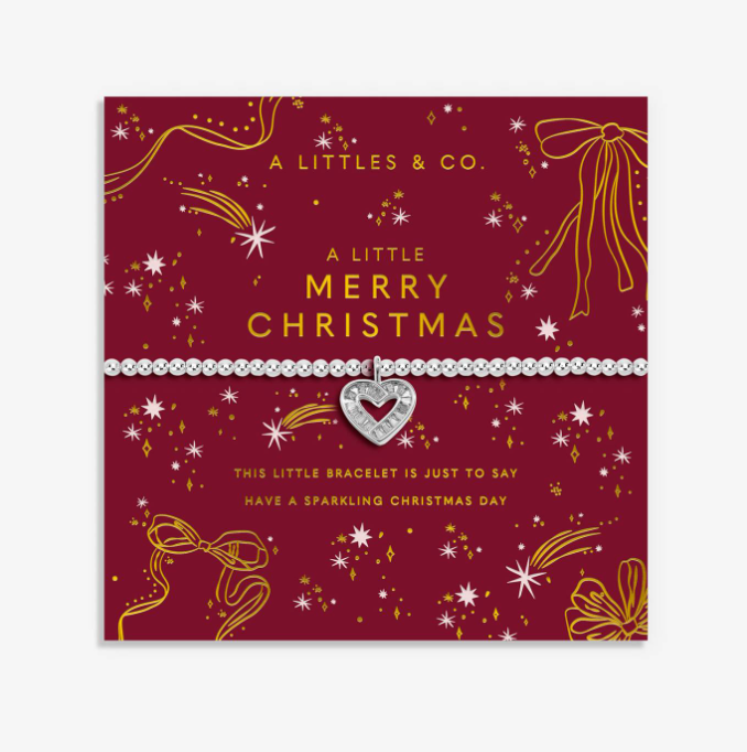A silver heart charm bracelet with clear rhinestone accents, presented on a festive red and gold Christmas greeting card by A Littlees & Co. Available at Be Charmed