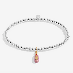 A Littles & Co Prosecco Ho Ho Ho silver and gold bracelet featuring a festive wine glass charm on a beaded band, available at Be Charmed