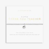 A silver beaded bracelet with a small apple charm, displayed on a white gift card from A Littlees & Co. The card features gold and gray text reading 'A LITTLE THANK YOU TEACHER' and 'THIS LITTLE APPLE IS JUST TO SAY THANK YOU FOR TEACHING ME SOMETHING NEW EVERY DAY'. Available at Be Charmed