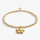 A Littles & Co Wonderful Grandma gold bracelet featuring a delicate gold charm on a beaded band, available at Be Charmed
