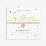 A Littles & Co You Make The Whole Place Shimmer gold bracelet featuring a delicate gold-toned charm on a beaded band, available at Be Charmed