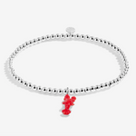 A Littles & Co You're My Lobster silver bracelet featuring a lobster charm on a beaded band, available at Be Charmed