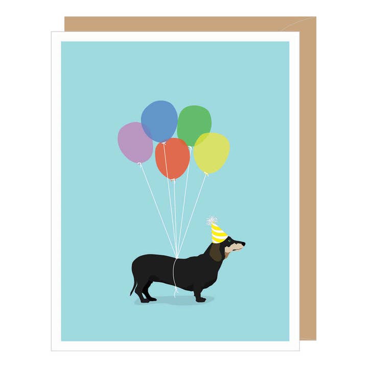 Apartment 2 Dachshund birthday card featuring a cute illustration of a dachshund wearing a party hat, available at Be Charmed