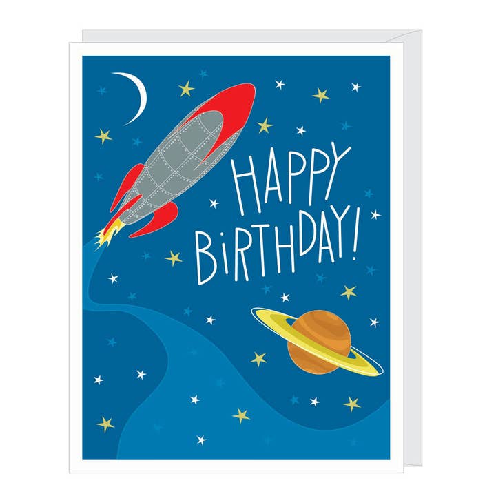Apartment 2 birthday card featuring an illustration of a rocket ship, available at Be Charmed