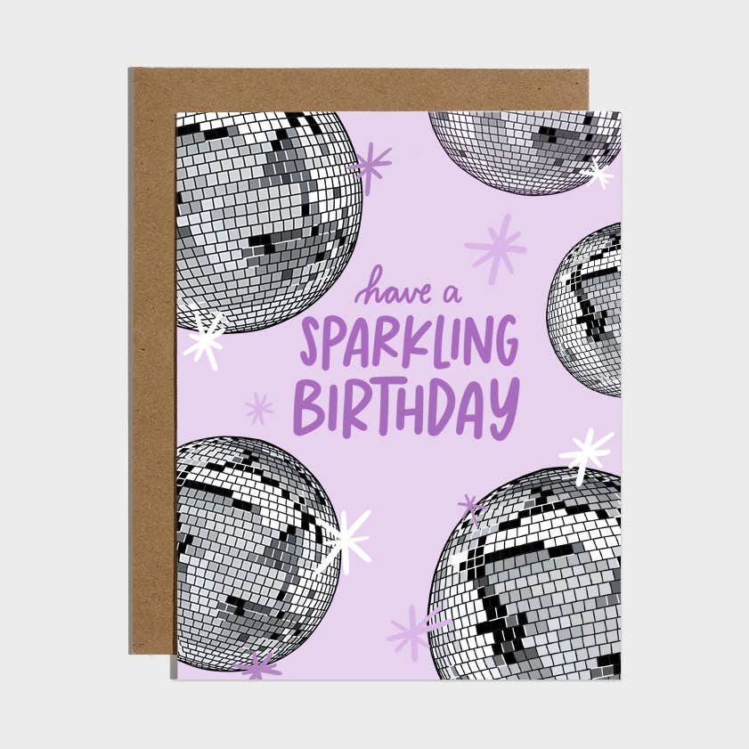 Brittany Paige birthday card featuring a graphic illustration of a disco ball and the text Have A Sparkling Birthday, available at Be Charmed
